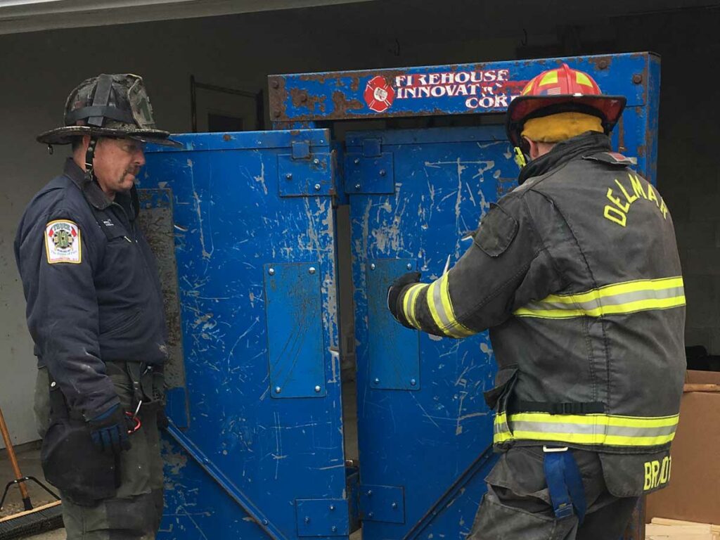 Firefighter uses forcible entry prop at FDIC International 2018