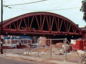 The bottom chord of this heavy timber wood truss is in tension