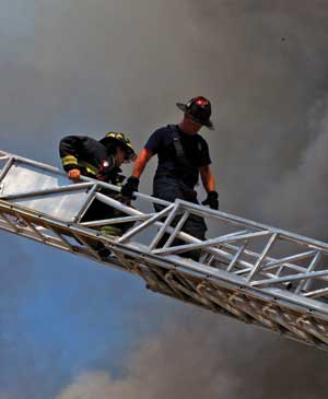 (1) You just know that these firefighters were allowed to get away with lack of personal protective equipment in the soft environment (and probably were not taken to task here, either). Allowing a failure in the soft environment will sooner or later manifest itself with a failure in the hard environment. The officer is responsible to break the chain of unacceptable soft environment behavior and activities before they result in unwanted hard environment consequences. (Photo by Tom Carmody.)