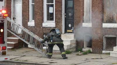 (7) Personnel must throw portable ladders prior to making entry and searching upper floors. (Photo by Nick Eid.)