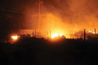 (5) A nighttime view of Camp Osborn in Brick Township, where 131 separate fires illuminated the nighttime skies. Fire companies were unable to access this area because of nonpassable roads.