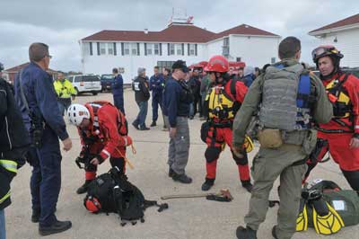 (2) Suffolk County TF1 prepares for deployment by helicopter during Hurricane Sandy. 