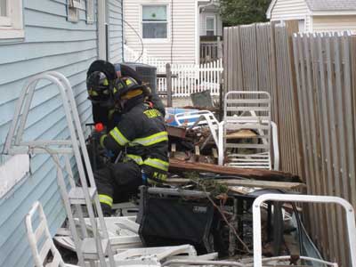 (2) Bergen County Task Force-1 (BC/TF-1) firefighters isolate a gas utility during a door-to-door search in the Silverton section. (Photos by Mark Fredrick.)