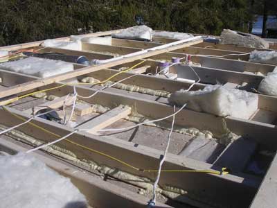 (7) Looking into the ceiling assembly of a modular home under construction, this will be the lower boundary of the void space. Note the use of adhesives.