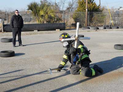 firefighter is holding the assembled 