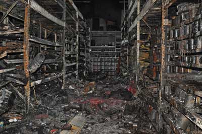 (2-3) The damaged storage racks in the paint department.