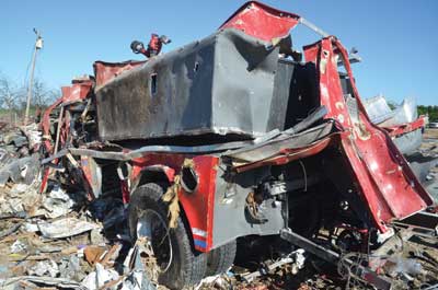 (7) The remains of and after effects of the blast on West Volunteer Fire Department Engine 2.