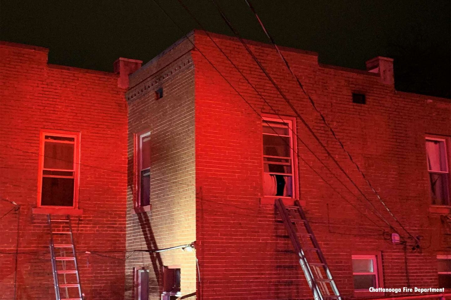 Multiple ladders thrown at apartment fire