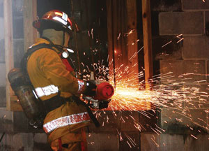 (3) A Shift Day participant performs forcible entry. (<i>Photo by Rayford Smith.</i>)