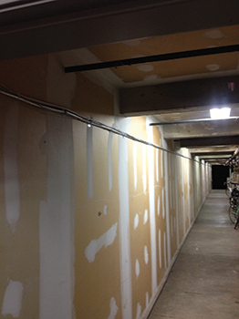 This Type 4 construction was framed out to create a hallway and storage compartments in the basement.