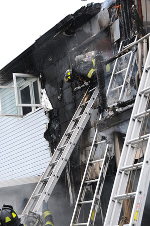 (6) The firefighter exited the window head first to stay low in the window below the heat and fire. 