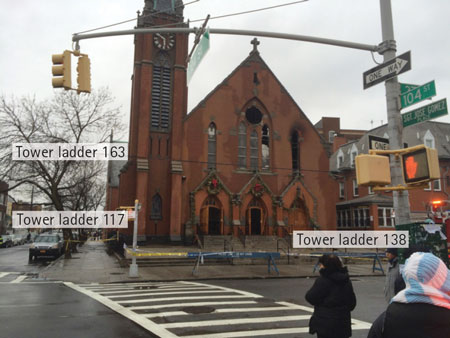 (2) As part of the street-management plan, Division 14 directed apparatus positioning of second-alarm units and positioned TL117 (assigned on the second alarm) and TL163 (the extra TL above the second alarm) on the exposure 2 side of the structure.