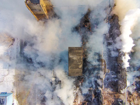 (1) The drone flying over the structure gives an incident commander (IC) a bird’s-eye view of the structure and all interior walls, which allows him to assess the building area’s stability that is not visible from the street. <i></noscript>(Photos by Trevor Hogan.) </i>“></td></tr><tr><td>(1) The drone flying over the structure gives an incident commander (IC) a bird’s-eye view of the structure and all interior walls, which allows him to assess the building area’s stability that is not visible from the street. <i>(Photos by Trevor Hogan.)</i></td></tr></tbody></table></figure>



<p>Recently (and often), drones [also known as unmanned aerospace vehicles (UAVs)] and the fire service have been in the news together. For instance, the presence of drones in wildfire fighting aircraft airspace has grounded all aircraft fighting the fire until the drone has vacated the area, and one video has surfaced showing a nozzle firefighter trying to knock down a drone with a hose stream.</p>



<p>Like it or not, drones are here to stay, and the fire service must be out in front on the issue, or we will be left behind. Much of this deals with educating the public and working with local, state, and the federal government to understand the current laws and then getting those laws in place to deal with the issues that drones pose.</p>


<table width=