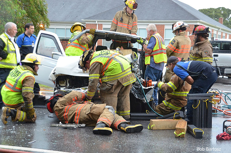 Firefighters work on extricating a victim from a car crash in North Carolina.