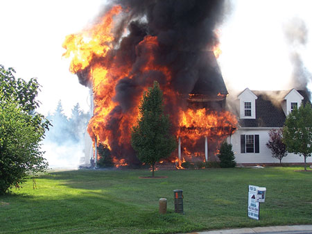 (3) Fire that began on the exterior quickly spread. This was the view when the fire crews arrived just six minutes after the alarm. 