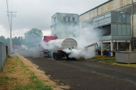 (2) A smoke machine simulates an anhydrous ammonia vapor leak from a delivery truck. The correct U.S. Department of Transportation specification cargo tank used for anhydrous ammonia was not available, so another tank simulated it. Full-scale exercises are usually conducted in a real-time, stressful environment to simulate a real incident.