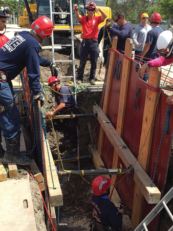 (1) A trench rescue wale operation using pneumatic shores. <i>(Photos by author.) </i>