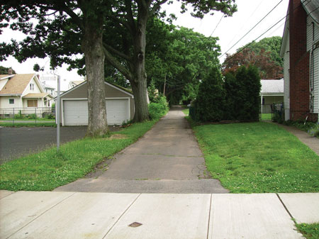 (1) A typical “alley-like” street in Meriden, Connecticut. The house at the end of the road (not seen from the road) is more than 400 feet away. There are four homes on this street. <i>(Photos 1-11 by Joe Scaglione.)</i>