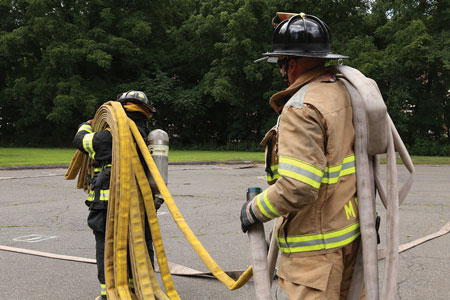 <b>(14) </b>After the 1¾-inch preconnect is disconnected from its jumper (pigtail/pony section), the nozzleman and driver/engineer will carry it to the wye at the end of the 2½-inch leader line. (<i>Photo by Matt Van Ness.)</i>