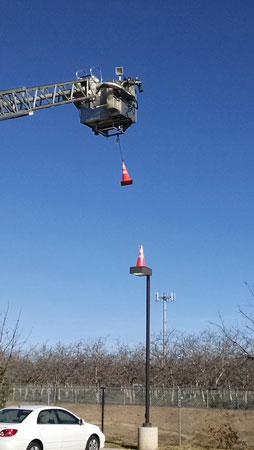 (2) Stacking cones is a great method the firefighter operating the aerial device can use to practice control.