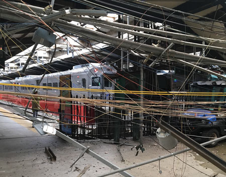 (1) Access and egress routes were initially blocked by electrical wiring and debris. <i>[Photos courtesy of the Hoboken (NJ) Fire Department.]</i>