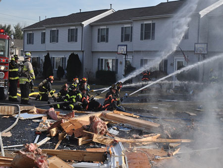 (3) Note the size and the mass of the house framing blown across the street from this single-home explosion. 