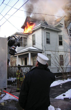 (3) Only white smoke is issuing from the vent hole, and the smoke from the dormer window is beginning to lighten up, evidence that the ventilation was effective and the engine company is making headway.