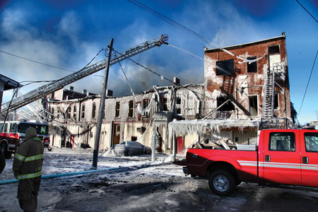 (1) Reading the building and setting up collapse zones are musts. Be diligent in adhering to these tasks. Ice on the building can be an eccentric load; we often forget this.<i> (Photo courtesy of PhotoShack Photography, Findlay, Ohio.)</i>