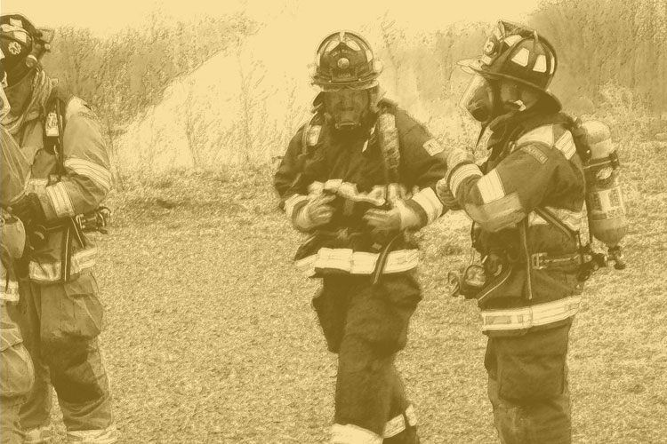 Firefighters in full SCBA and turnout gear