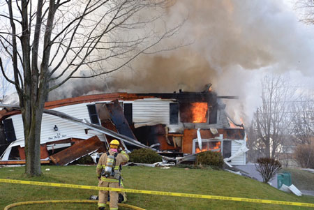 (2) A view of the house after the explosion.