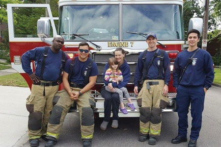 (1) Norfolk (VA) Fire-Rescue firefighters stop to talk with a little girl and her mother as they return from a call. (Photos by author.)