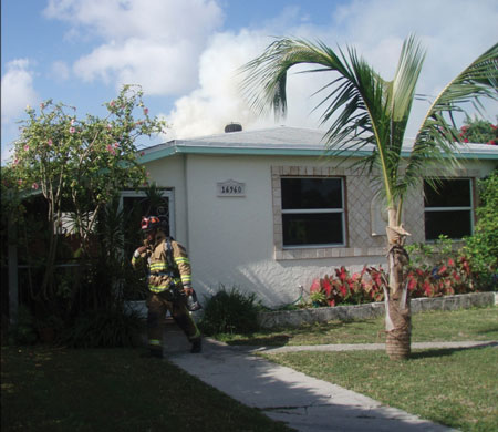 (1<b>-2)</b> Nothing showing does not definitively indicate that there is no fire condition in the building. (Photos 1-2 by Corey Logan.)