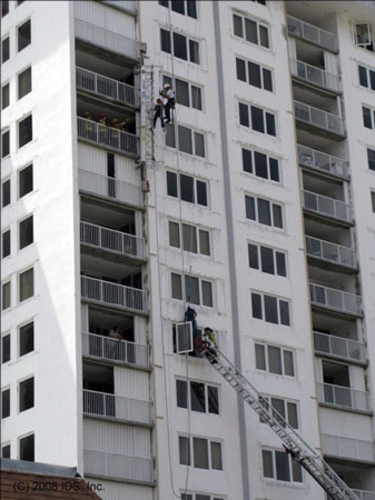 (8) A collapsed scaffold anchor has caused two workers to fall onto their lifelines. One worker fell a great distance, possibly because of slack between the rope grab and the anchor. Designate the area below this 1,000-pound scaffold a no-entry, fall zone. <i>[Photo courtesy of the Fort Lauderdale (FL) Fire Department.] </i>