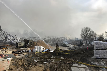 (6) Crews continued to flow water well into the next day to ensure that the fires had been fully extinguished. (Photo by Addie Chapin.)