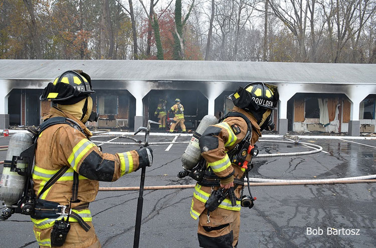 Firefighters in gear outside a motel fire in North Carolina