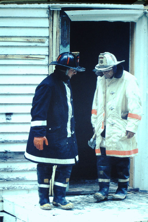 Firefighters in long coats