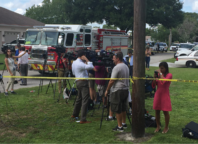 (2) The initial news media staging location just outside the sinkhole perimeter.