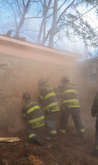 (4) Three members of Rescue 1 attempted to convert a window into a door using power tools. Because of the dust created, they stopped and switched to hand tools. 