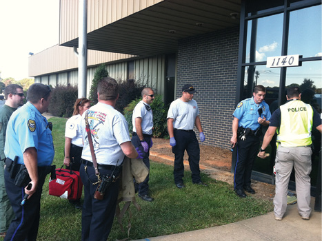 (1) Members of the Kernersville (NC) Fire Department, Kernersville Police Department, and Forsyth County Emergency Services prepare to enter a building during joint-agency, active-assailant rescue task force introductory training. The agencies were testing techniques, operations, and equipment for use during such an incident. (Photo by August Vernon.)