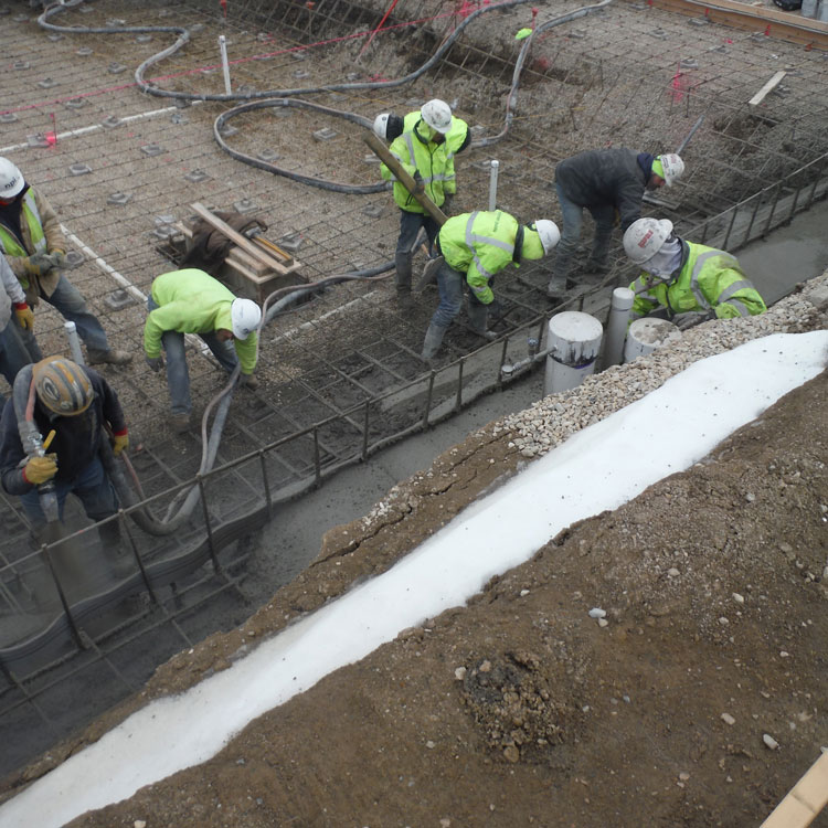 Concrete finishers work on swimming pool