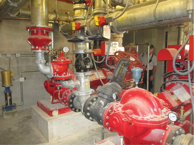 (7) Two diesel-driven fire pumps operate in a series to supply a two-zone combination sprinkler/standpipe system. The low-zone pump supplies the low zone and discharges into the intake of the high-zone pump, essentially doubling the pressure developed by the high-zone pump. (Photos 7-9 by Eric Goodman.) 