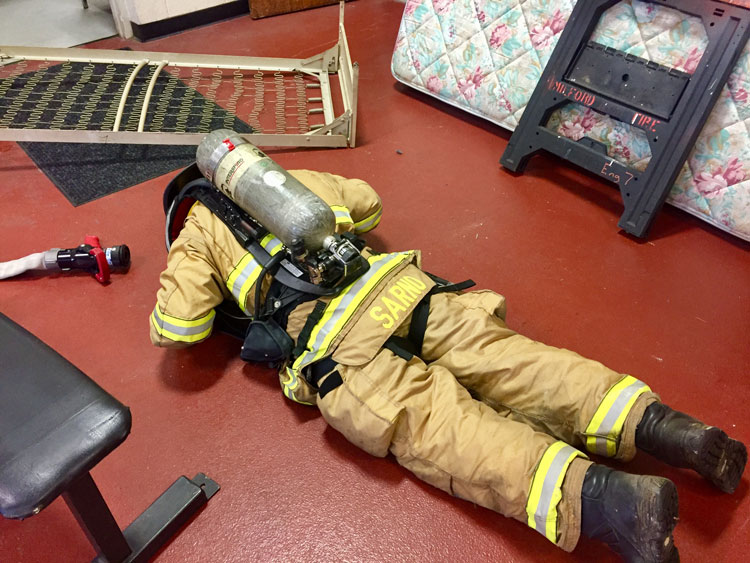 Firefighters perform rapid intervention team training