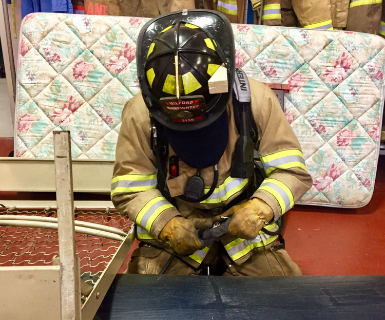 Rescue firefighter makes access to colleague pinned under debris