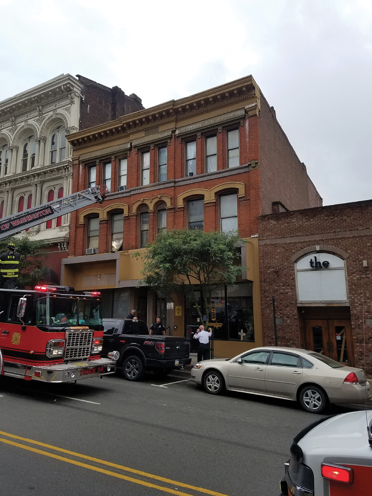 A postincident view of the A side of the red collapse building and the abutting B and D exposures. (Photo by Jeffrey Yates.) 