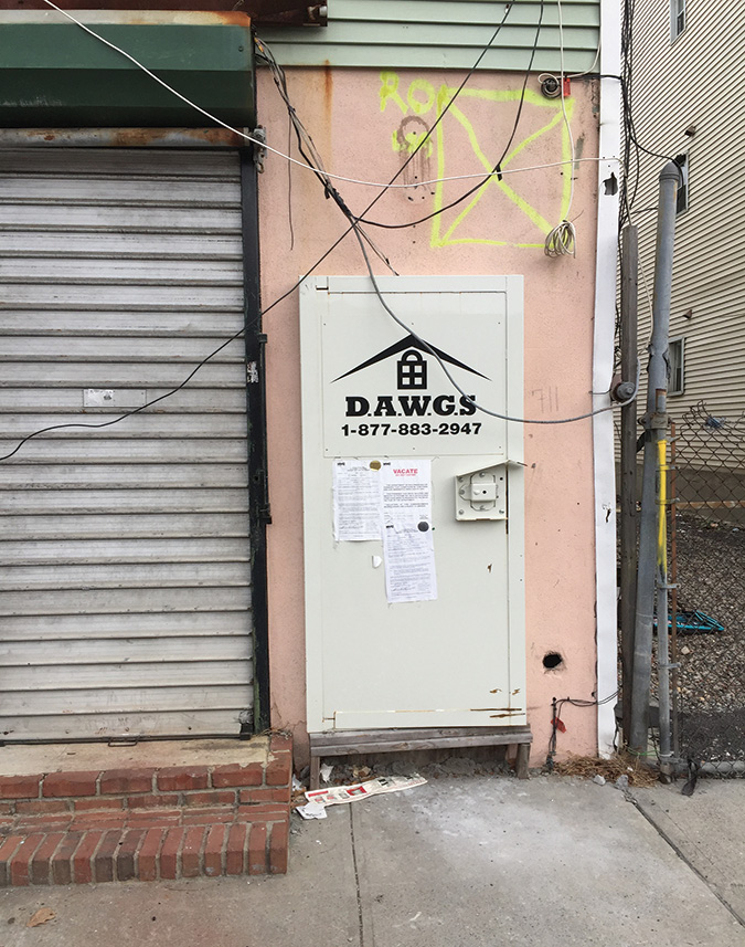 (2) The door system and vacant building marking. On both buildings, the marking of “X” inside a box with the letters “RO” means roof open, no entry, exterior operations only, marked by Ladder 29. For a building in bad disrepair, we would search depending on the fire condition. If there is heavy fire, we would wait until it is under control and search from areas of safety. 