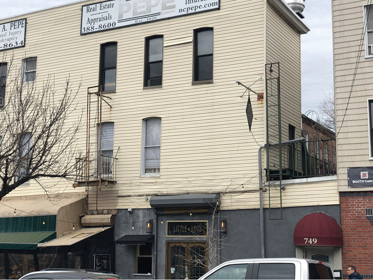 This fire escape on a renovated multistory factory is missing one critical component: railings over the well hole. Occupants or firefighters exiting the buildings through these exterior doors will easily fall to the ground through these series of holes.