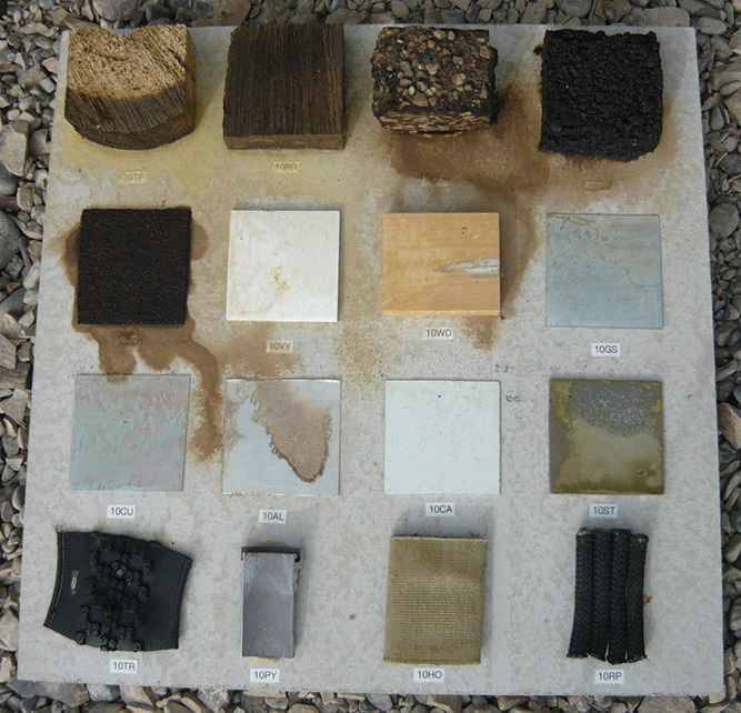 Trial 5, 2015. Witness board #10 after complete evaporation of the liquid chlorine exposure. Note the dissolving hydrocarbons and metal corrosion.