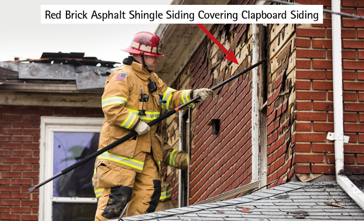 (18) Red brick-style asphalt shingle siding covering clapboard siding, 1439 hours.