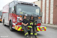 Chicago firefighters at repose on an apparatus at the scene of the building collapse.