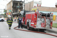 Chicago firefighters and a rig at the scene.